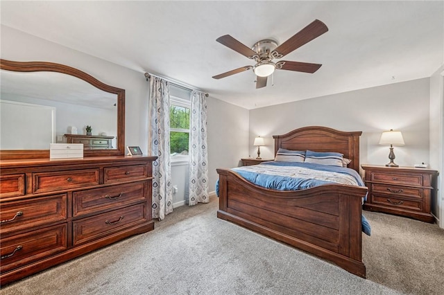 bedroom with baseboards, light colored carpet, and ceiling fan