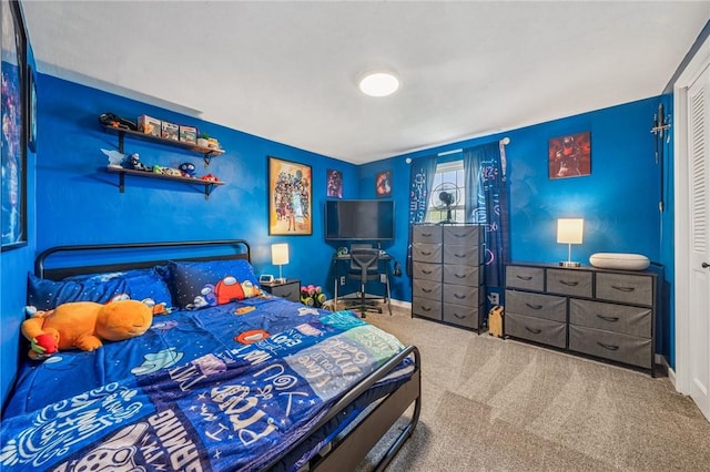 bedroom featuring carpet floors and baseboards