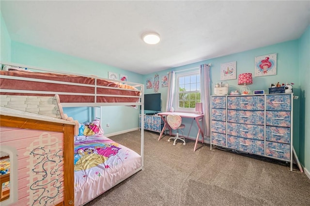 bedroom featuring baseboards and carpet