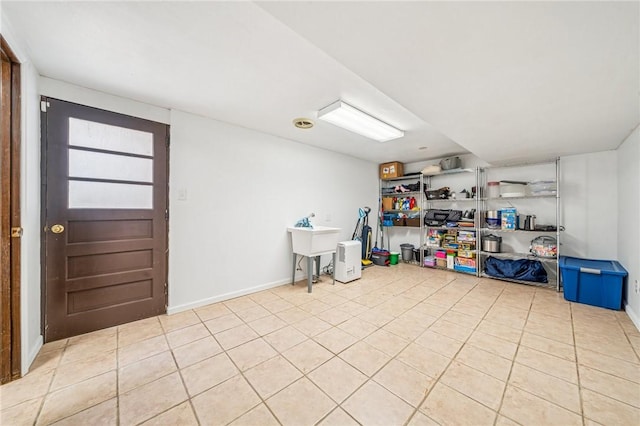 interior space with light tile patterned flooring and baseboards