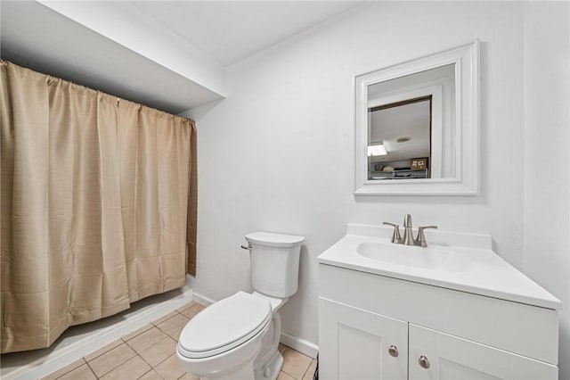 bathroom featuring vanity, toilet, baseboards, tile patterned floors, and a shower with curtain