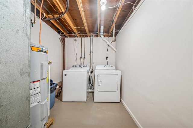 laundry area featuring separate washer and dryer, laundry area, and electric water heater