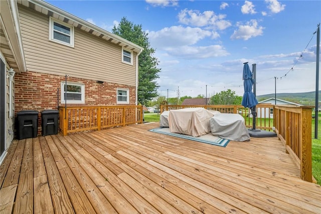 wooden deck featuring grilling area