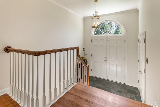 2650 Quail Hill Dr, Upper St Clair, PA 15241 - entrance foyer with stone tile flooring, a chandelier, baseboards, and crown molding