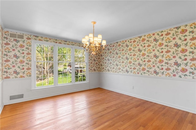 2650 Quail Hill Dr, Upper St Clair, PA 15241 - empty room featuring wallpapered walls, a chandelier, a wainscoted wall, light wood-type flooring, and baseboards