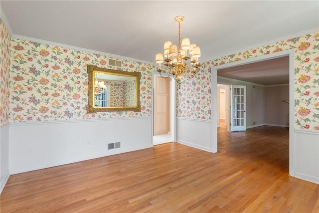 2650 Quail Hill Dr, Upper St Clair, PA 15241 - empty room featuring wainscoting, wallpapered walls, a chandelier, light wood finished floors, and ornamental molding