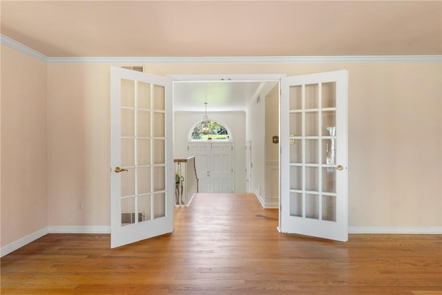 2650 Quail Hill Dr, Upper St Clair, PA 15241 - corridor featuring french doors, wood finished floors, baseboards, and ornamental molding