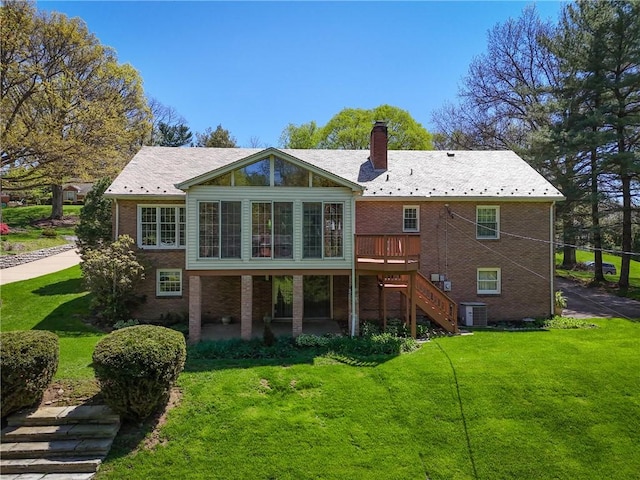 2650 Quail Hill Dr, Upper St Clair, PA 15241 - rear view of house with brick siding, a chimney, a yard, and stairway