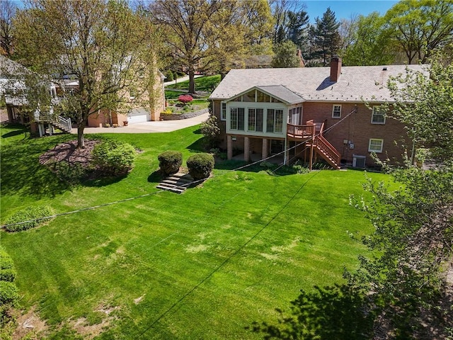 2650 Quail Hill Dr, Upper St Clair, PA 15241 - back of property featuring stairs, a chimney, a yard, and a deck