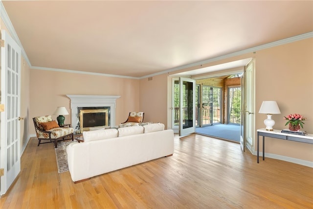 2650 Quail Hill Dr, Upper St Clair, PA 15241 - living area featuring light wood-type flooring, crown molding, a glass covered fireplace, and baseboards