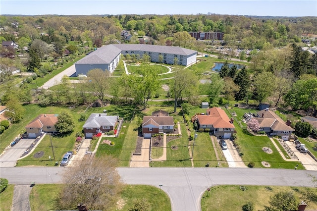 birds eye view of property with a residential view