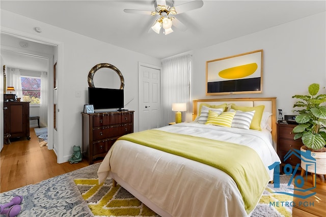 bedroom with ceiling fan and wood finished floors