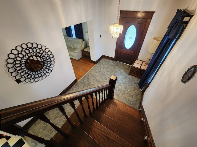 828 Butler Ave, New Castle/4Th, PA 16101 - entryway featuring an inviting chandelier, baseboards, stairway, and wood finished floors