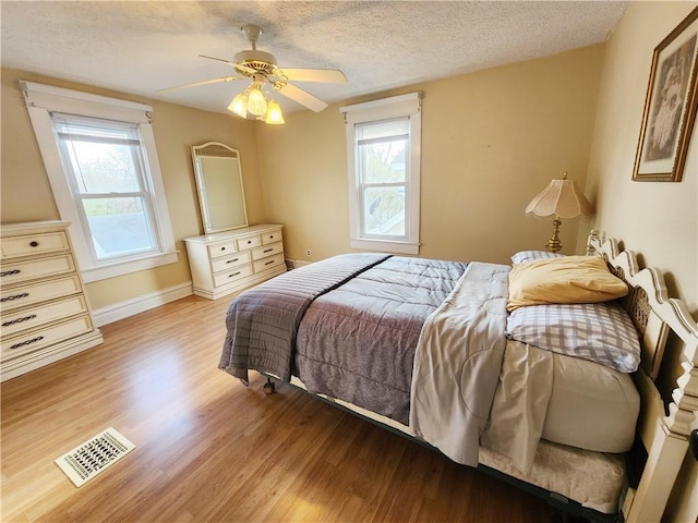 828 Butler Ave, New Castle/4Th, PA 16101 - bedroom with light wood-style floors, multiple windows, and visible vents
