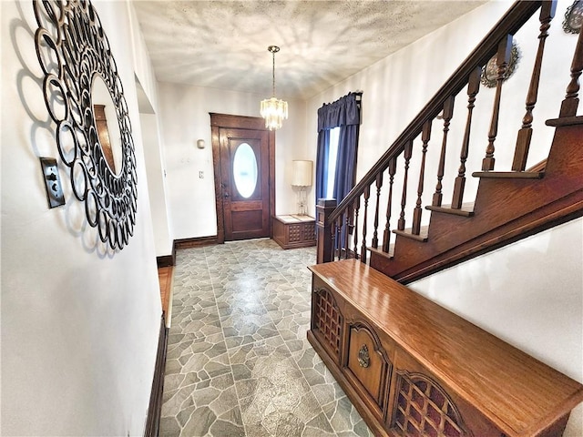 828 Butler Ave, New Castle/4Th, PA 16101 - foyer with baseboards, a chandelier, stone finish floor, and stairway