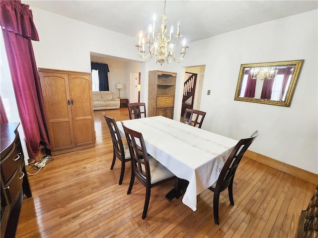 828 Butler Ave, New Castle/4Th, PA 16101 - dining room with an inviting chandelier, baseboards, and light wood finished floors