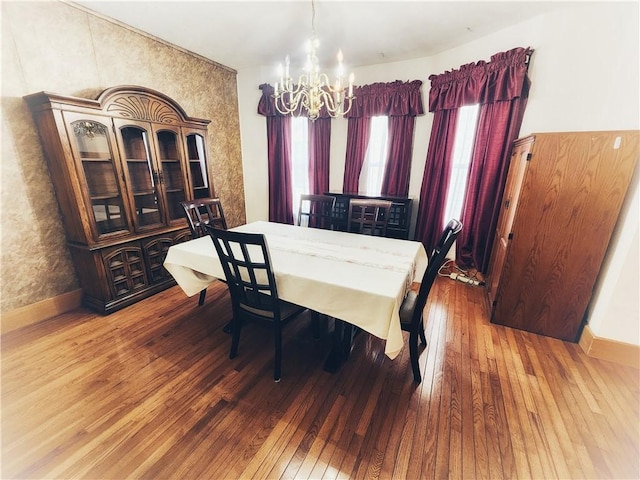 828 Butler Ave, New Castle/4Th, PA 16101 - dining area featuring an inviting chandelier, baseboards, and hardwood / wood-style floors