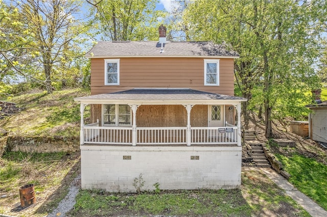 109 White St, Bentleyville, PA 15314 - view of front of house with covered porch, a chimney, and roof with shingles