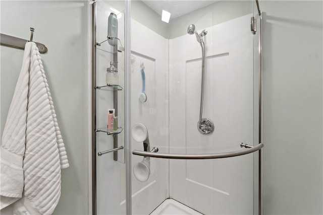 full bath with a shower stall