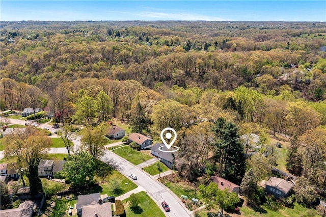 birds eye view of property with a residential view and a forest view