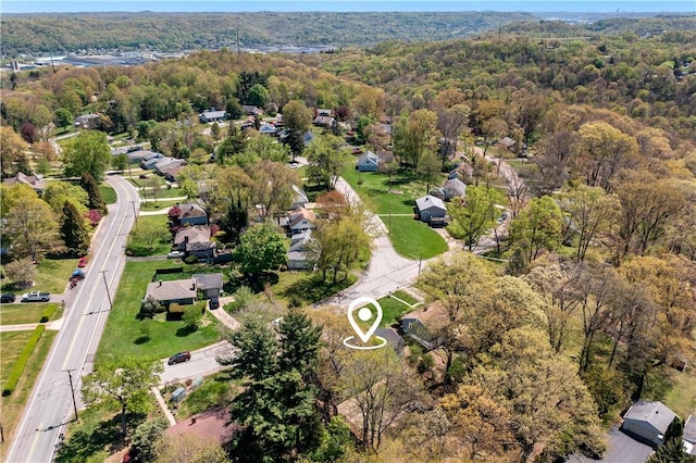 bird's eye view featuring a view of trees and a residential view