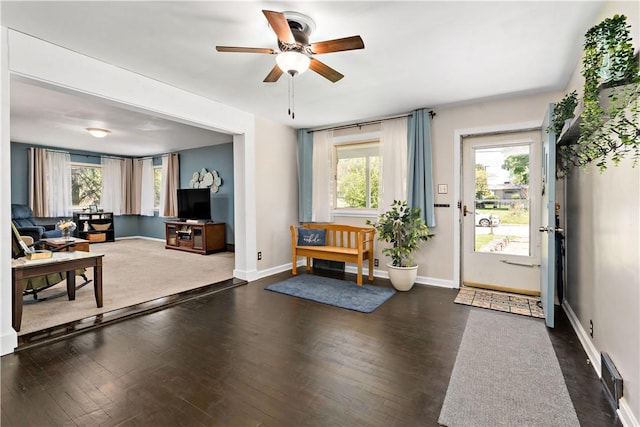 entrance foyer with a ceiling fan, baseboards, and a wealth of natural light