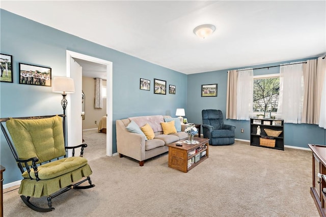living room featuring baseboards and carpet flooring