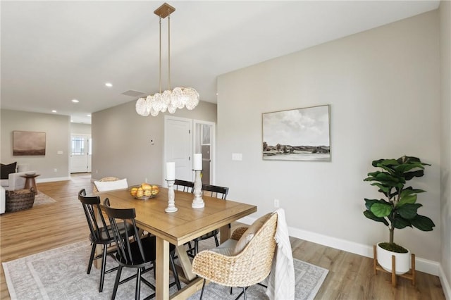 dining area featuring light wood-type flooring, recessed lighting, and baseboards