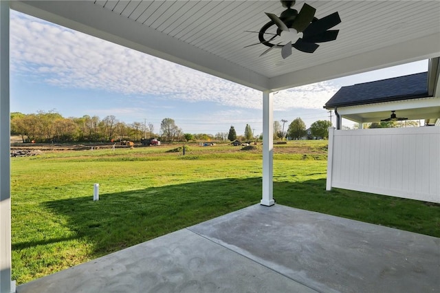 view of patio / terrace with ceiling fan and a rural view