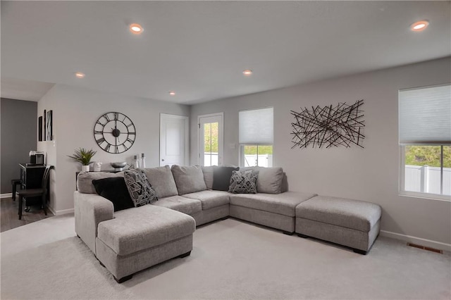 418 Fosse Ct, Lancaster Twp, PA 16037 - living room with baseboards, visible vents, a wealth of natural light, and carpet
