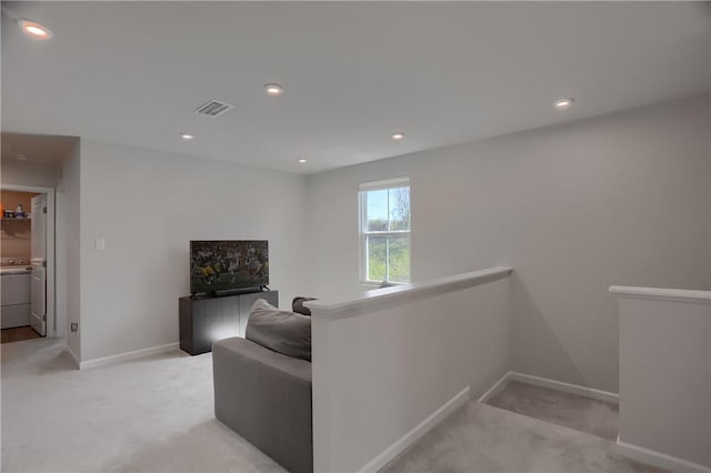 418 Fosse Ct, Lancaster Twp, PA 16037 - hall with baseboards, light carpet, an upstairs landing, and visible vents