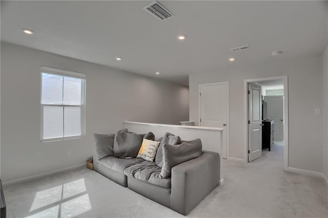 418 Fosse Ct, Lancaster Twp, PA 16037 - living room featuring visible vents, baseboards, and light colored carpet