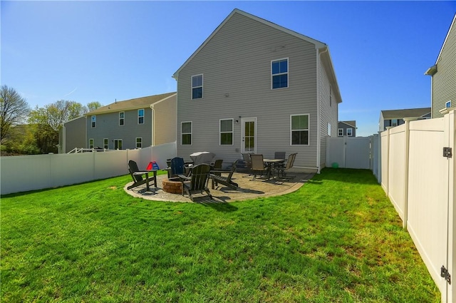 418 Fosse Ct, Lancaster Twp, PA 16037 - rear view of house with a fenced backyard, a patio, a lawn, and an outdoor fire pit