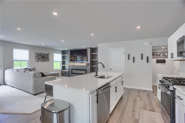 418 Fosse Ct, Lancaster Twp, PA 16037 - kitchen with a sink, light countertops, stainless steel appliances, and white cabinetry
