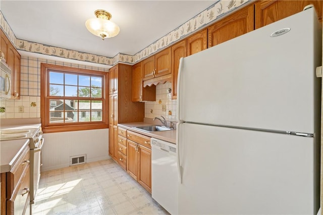 327 Pinehaven Dr, Upper St Clair, PA 15241 - kitchen featuring visible vents, white appliances, light floors, light countertops, and a sink