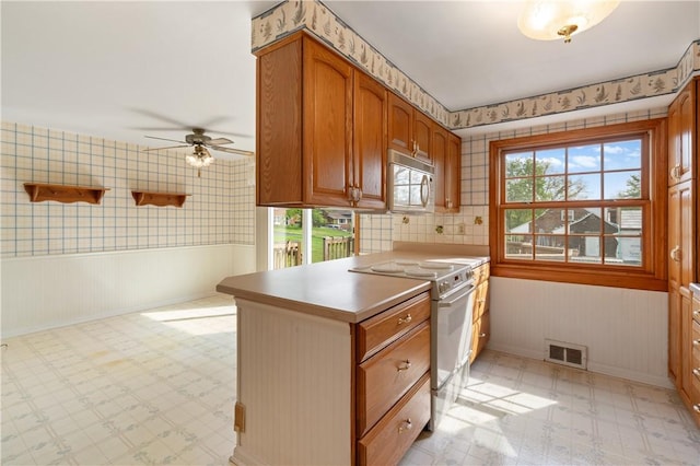 327 Pinehaven Dr, Upper St Clair, PA 15241 - kitchen featuring a ceiling fan, visible vents, light countertops, light floors, and white appliances