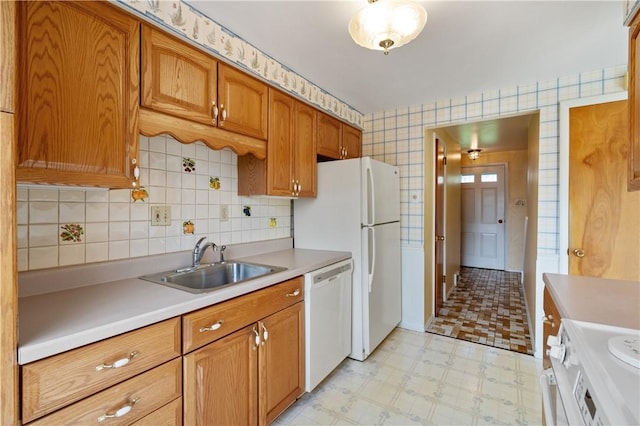 327 Pinehaven Dr, Upper St Clair, PA 15241 - kitchen with brown cabinets, a sink, white appliances, light countertops, and light floors