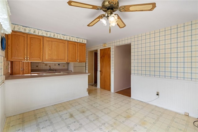 327 Pinehaven Dr, Upper St Clair, PA 15241 - kitchen with light floors, freestanding refrigerator, a ceiling fan, and brown cabinetry
