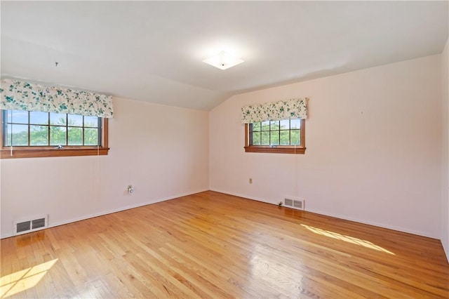 327 Pinehaven Dr, Upper St Clair, PA 15241 - unfurnished room featuring visible vents, light wood finished floors, baseboards, and vaulted ceiling