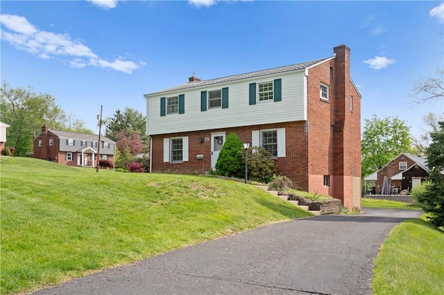 327 Pinehaven Dr, Upper St Clair, PA 15241 - colonial house with a chimney, a front lawn, and brick siding