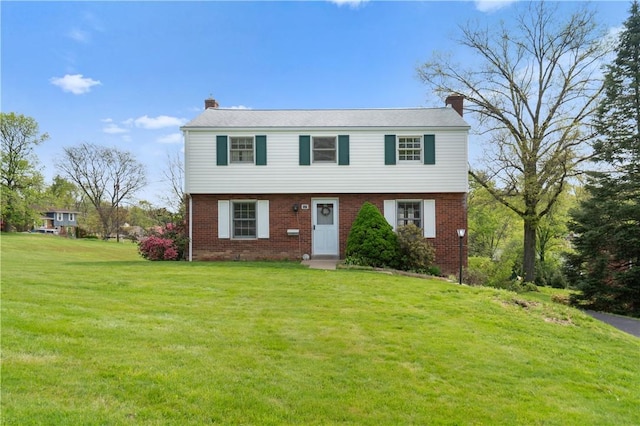 327 Pinehaven Dr, Upper St Clair, PA 15241 - colonial inspired home with brick siding, a front yard, and a chimney