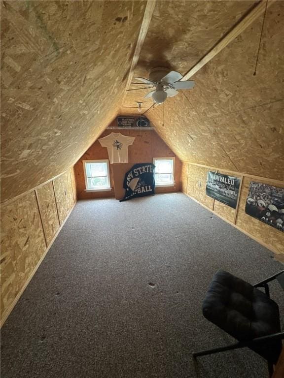 bonus room featuring carpet floors, a ceiling fan, and lofted ceiling
