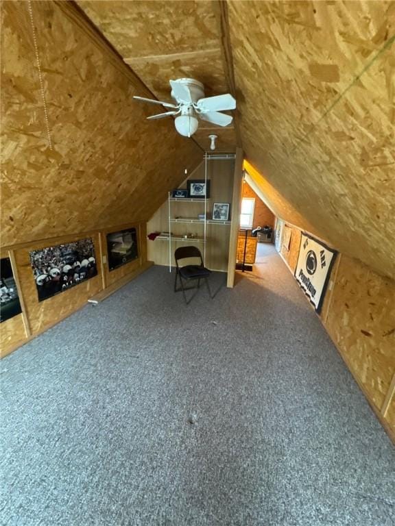 bonus room with a ceiling fan, lofted ceiling, and carpet flooring