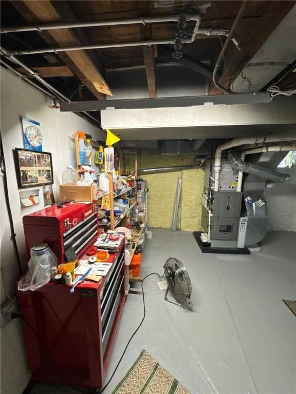 below grade area featuring heating unit