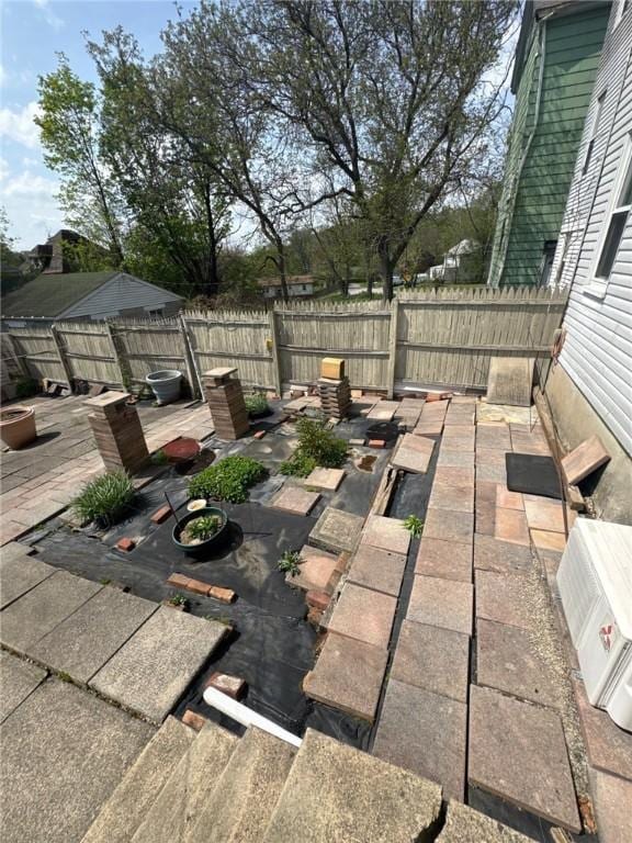 view of patio / terrace with a fenced backyard and a deck