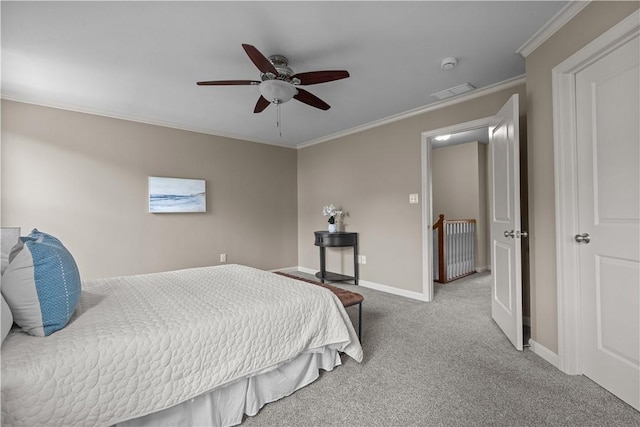 carpeted bedroom with baseboards, ornamental molding, a ceiling fan, and visible vents
