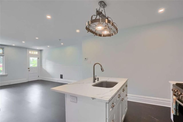 239 Trowbridge St, Hazelwood, PA 15207 - kitchen with a sink, stainless steel range with gas stovetop, recessed lighting, white cabinets, and light stone counters