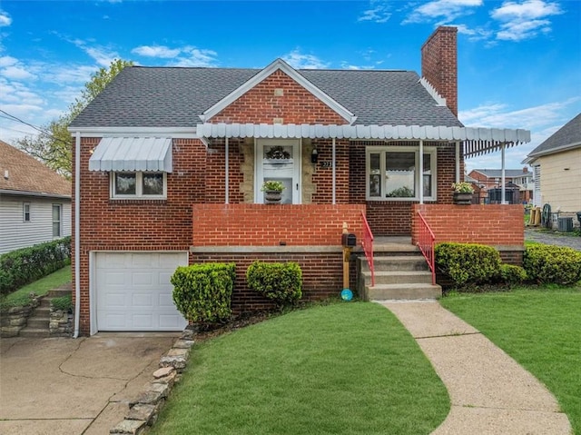 view of front facade featuring a chimney, roof with shingles, a garage, brick siding, and a front lawn