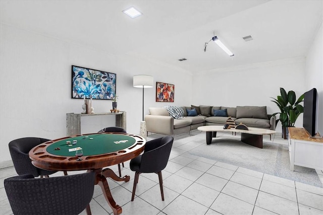 rec room featuring light tile patterned floors and visible vents