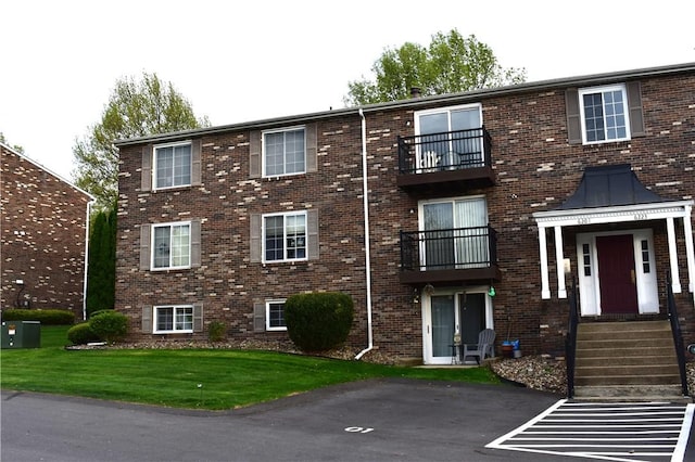 view of building exterior with uncovered parking